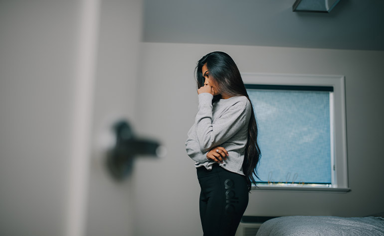 Woman person in her quarters coping with depression symptoms.